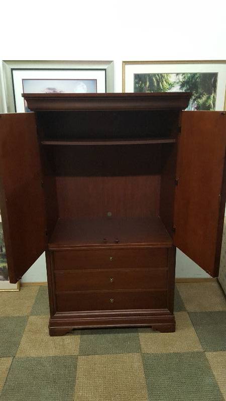 lot 9 image: Thomasville 3 Drawer Armoire. Dark wood finish.