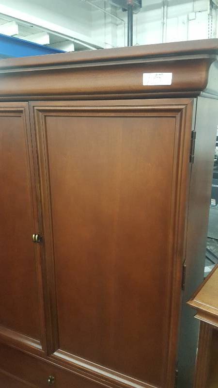 lot 10 image: Thomasville 3 Drawer Armoire. Dark wood finish.