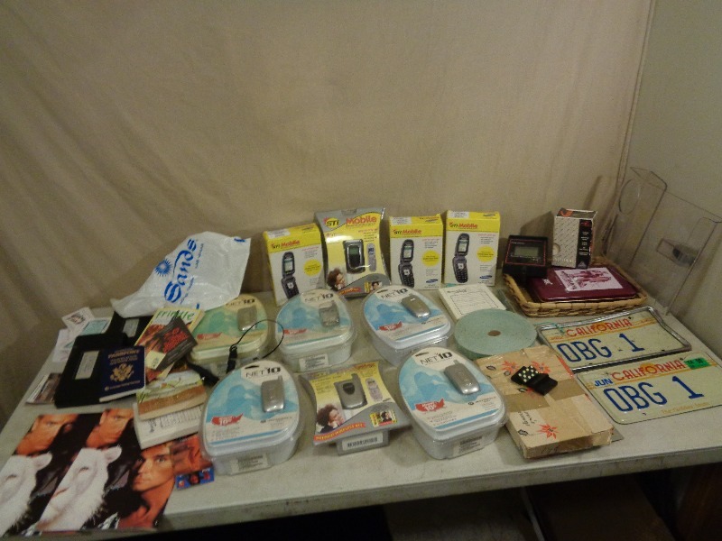 lot 218 image: New Cellphones, California License Plates, Dominos, and More