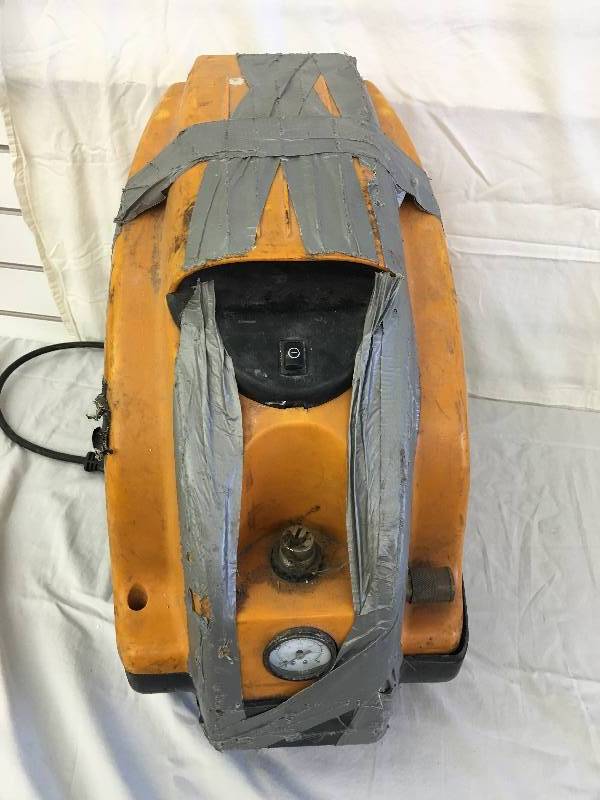lot 35 image: BOSTITCH CAP1516 Trim Air 8 Amp 1-12-Horsepower 1.6-Gallon Oil-Free CAmper-Shaped Compressor used but works