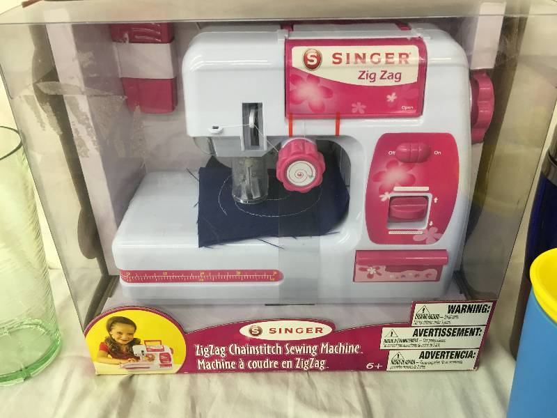 lot 223 image: Singer Chainstitch Battery Operated Sewing Machine, shrinx belly cups