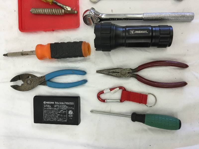 lot 461 image: tools, flashlight, drill bits and external battery