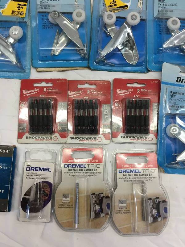 lot 571 image: drawer replacement hardware, milwaukee power bits and dremel trio cutting bits