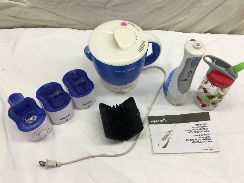 lot 580 image: water pik and 3 bellhowell personal humidifiers
