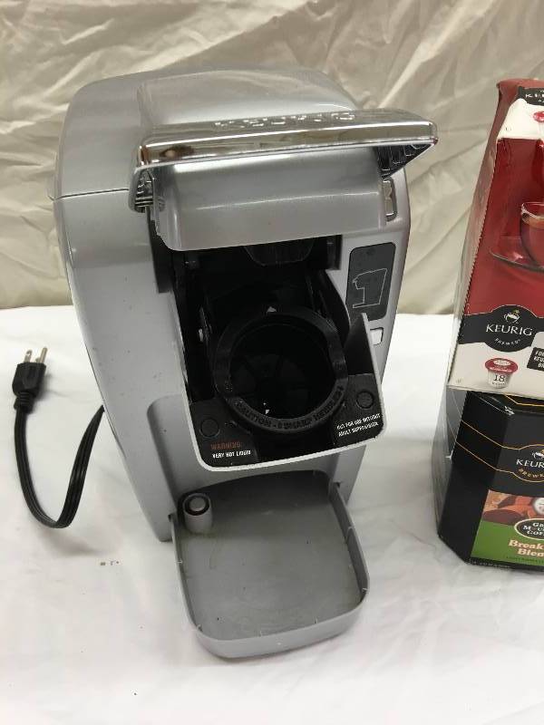 lot 592 image: Keurig MINI Plus Personal K-Cup Brewing System retail $80 and coffee