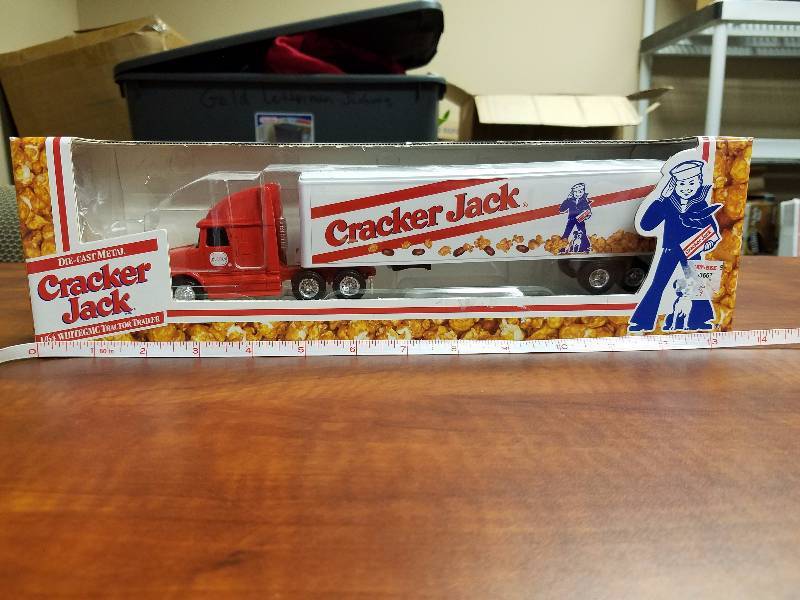 lot 11 image: Cracker Jack 164 White GMC tractor Trailer