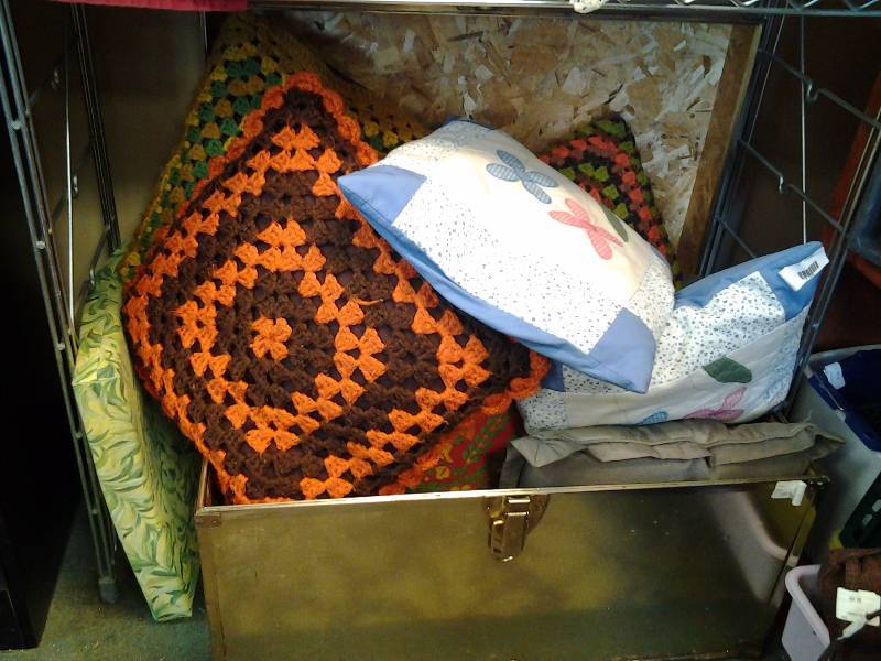 Metal Foot Locker Full Of Throw Pillows
