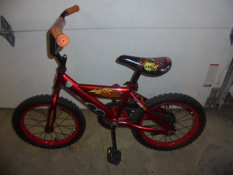 lot 32 image: HUFFY Boys Cars Bicycle