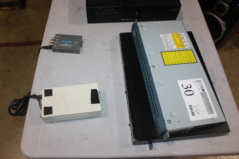 lot 30 image: Lot of (4) Electronic Equipment Including 1) JVC AC Adaptor AA-P700 AND 1) Aja D10CEA SDI To ComponentComposite Video, 4-Channel Balanced Audio AND 2) D-Link 10100 DES-1252 Hub