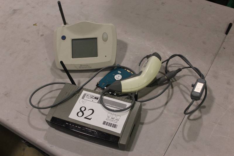 lot 82 image: Lot of (4) Electronic Equipment Including 1) Latitude Communicator 6476 AND 1) Scanplus 1800 SR AND 1) Toshiba HDD AND 1) D-Link Wireless Gateway