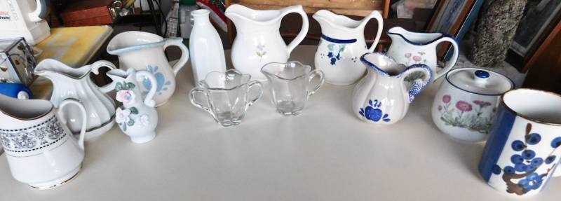 large lot of small china pitchers