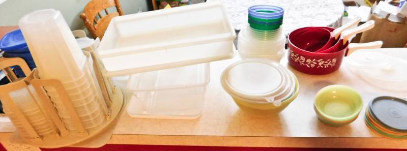 large lot of plastic storage items