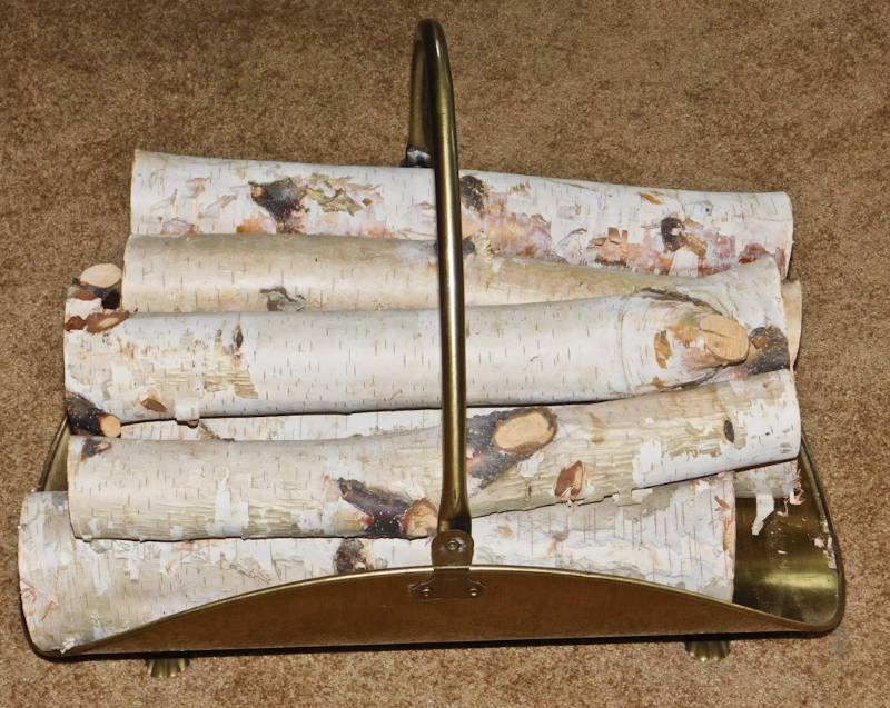 brass firewood holder with real birch logs