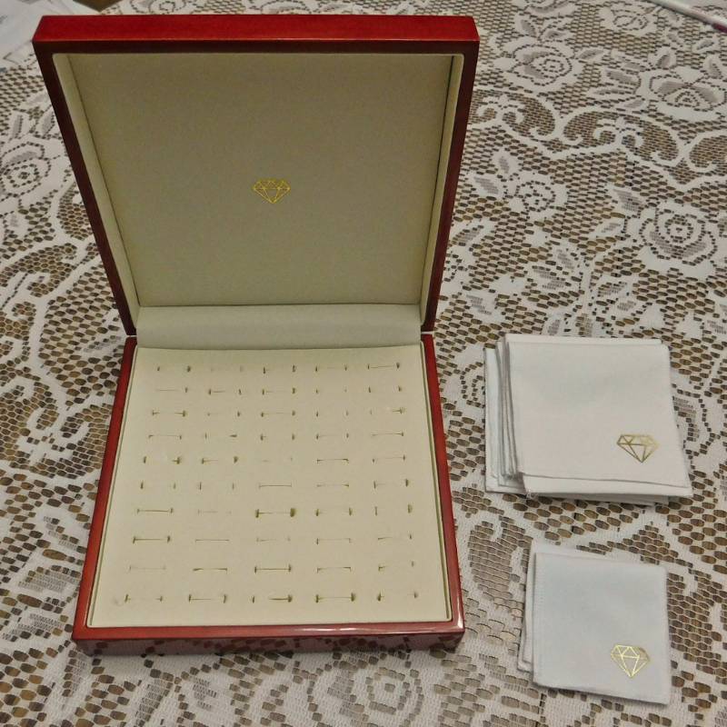 Jewelry box holds 50 rings and several clth fold over pouch