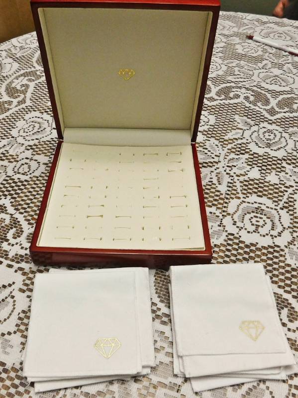 Jewelry box holds 50 rings and several clth fold over pouch