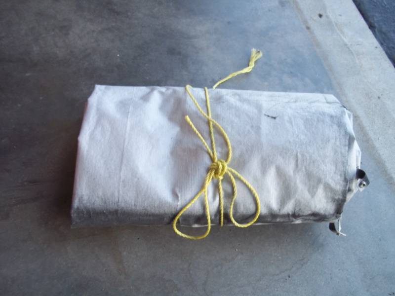 Gray tarp good for woodpile