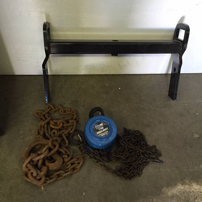lot 35 image: 9 LOG CHAIN, GRIP 1 TON CHAIN HOIST, ROOM DIVIDER 51 X 71 METAL HITCH, KEURIG COFFEE MAKER