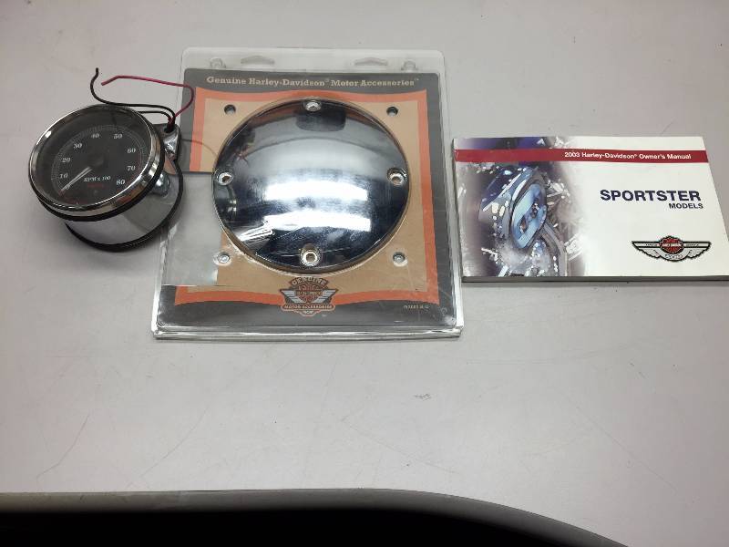 lot 43 image: HARLEY DAVIDSON MOTORCYCLE PARTS, SEAT,PRIMARY COVER, HANDLE BAR RISERS, BACK REST AND HEADLIGHT