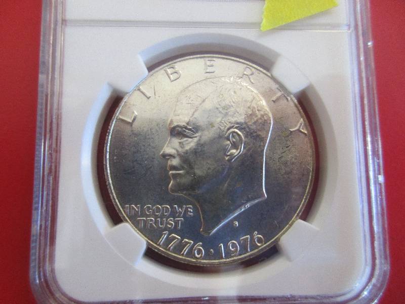 10. 1776-1976 Eisenhower Silver Dollar in Mint State Condition. Beautiful silver dollar with the special Moon and Bell reverse design to celebrate the 200th anniversary of the United States.