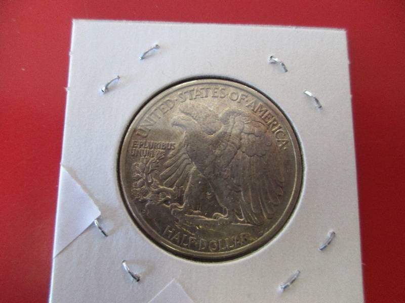 17. 1939-D Walking Liberty Half Dollar in AUBU Condition with a light smoky toning
