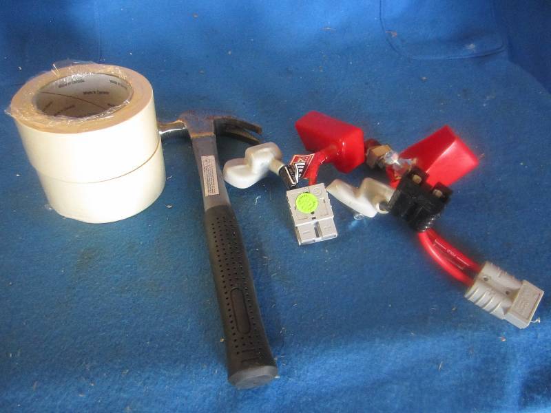 Mixed lot of tape, hammer, and batt...