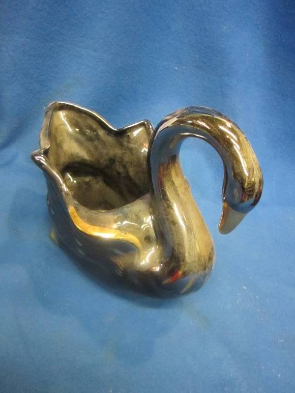 metallic looking decorative swan pl...