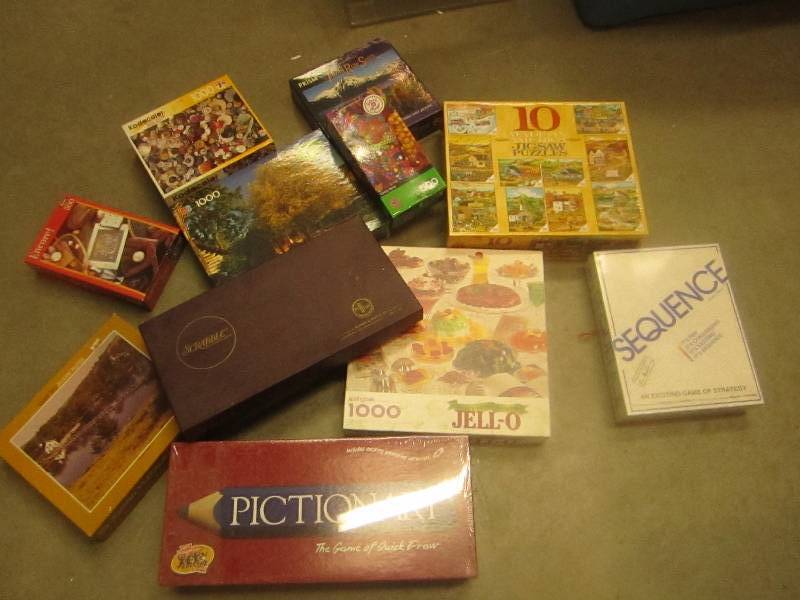 large lot of puzzles and brand new ...