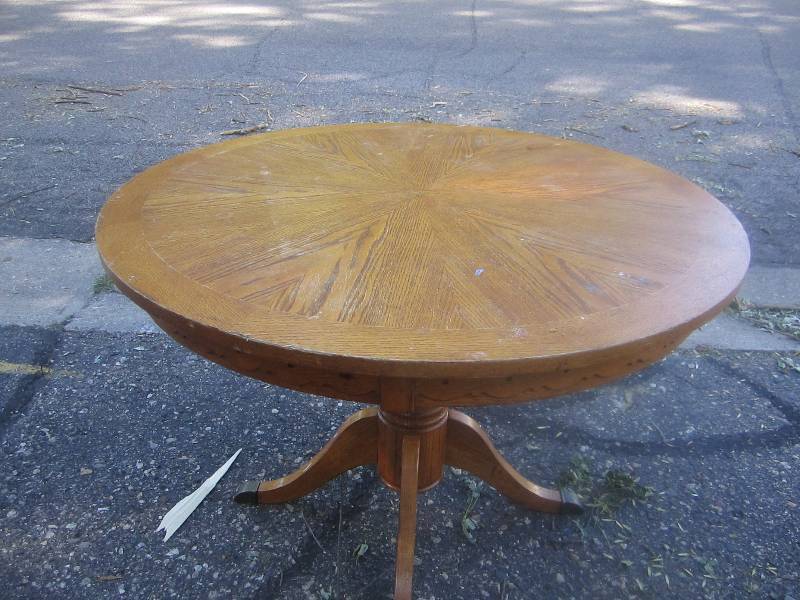 round wooden table with decorative ...