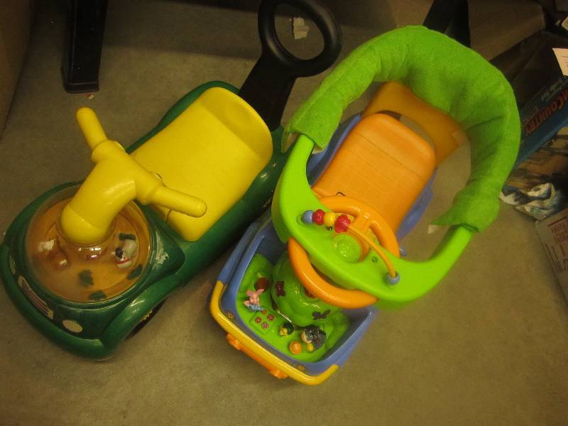 2 kids riding toys ...