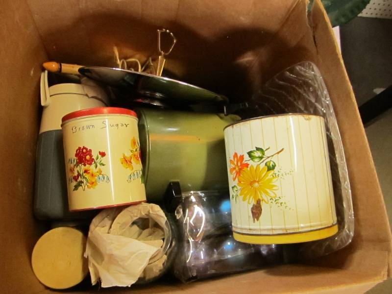 Box of kitchen supplies, dishes and...
