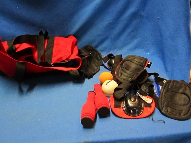 Bag of sports equipment, knee pads ...