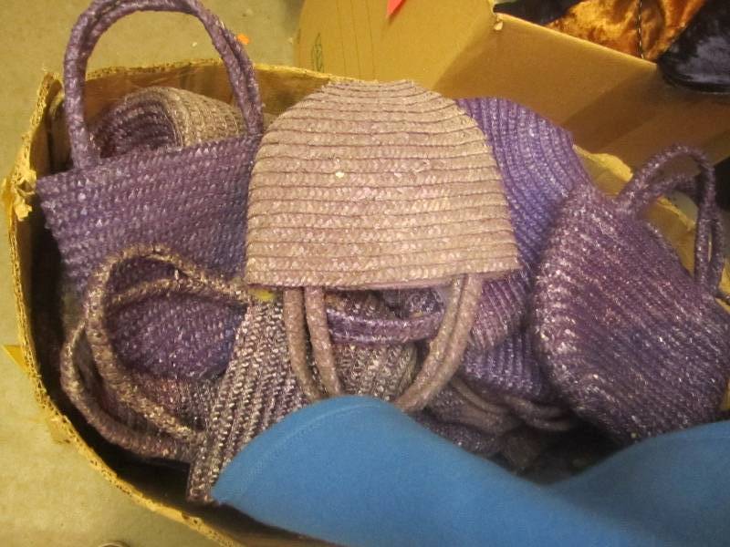 Box of purple purses huge value...