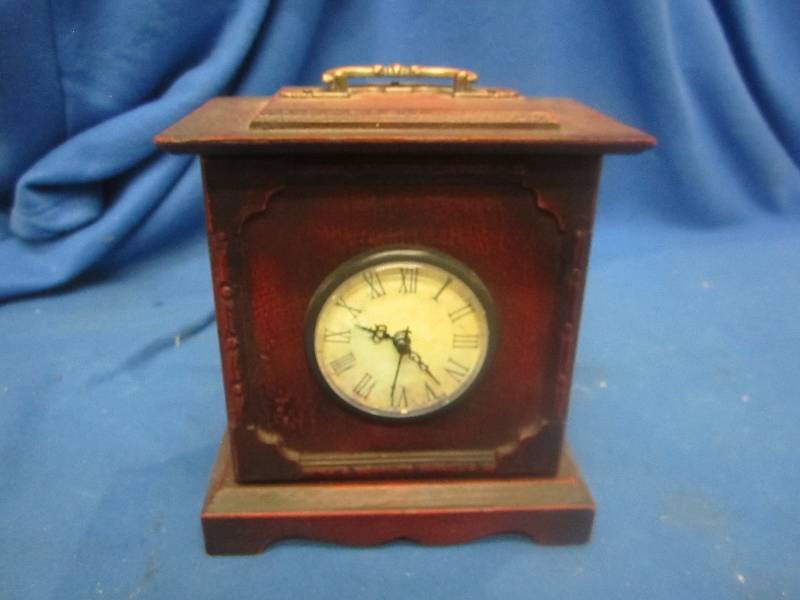Small clock with inside storage...