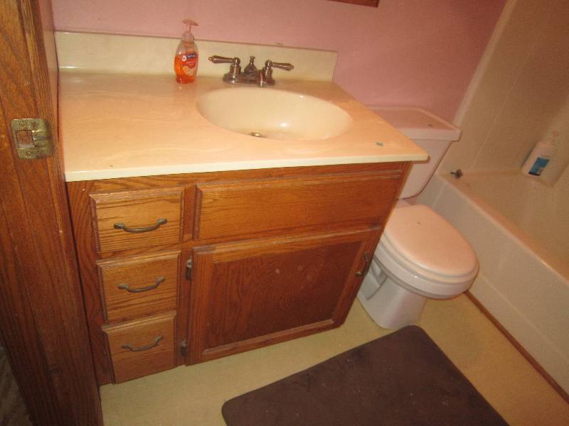 lot 26 image: Oak Vanity with Marble Top and Faucet