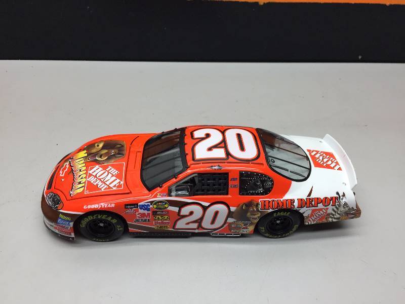 lot 1 image: TONY STEWART #20 MADAGASCAR 124 SCALE COLLECTIBLE CAR