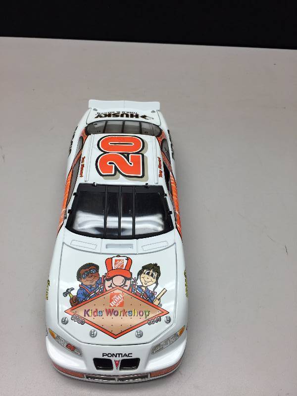 lot 11 image: TONY STEWART #20 KIDS WORK SHOP 124 SCALE CAR COLLECTIBLE CAR