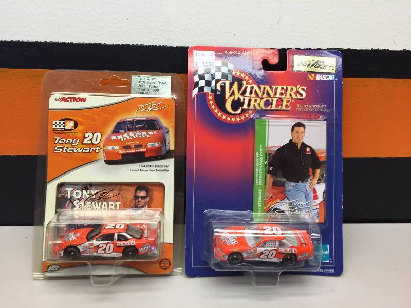 lot 24 image: TONY STEWART 2000 HOME DEPOT DESIGN, 2000 PONTIAC, 1999 PONTIAC GRAND PRIX THE HOME DEPOT PEANUTS CAR
