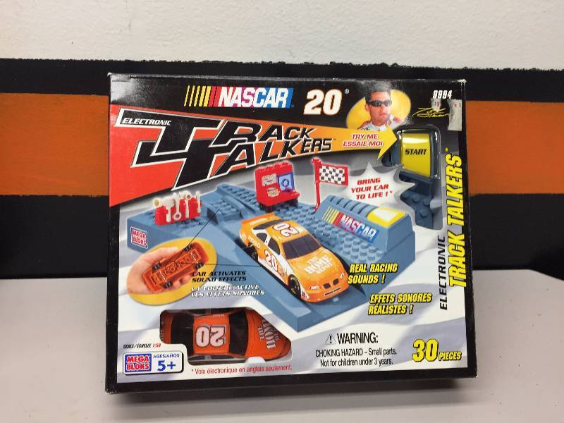 lot 25 image: TOY STEWART ELECTRONIC TRACK TALKERS HOME DEPOT, HOME DEPOT COCA-COLA POLAR BEAR CAR IN A BOTTLE, BOBBLE HEAD DOLL, BEACH TOWELS