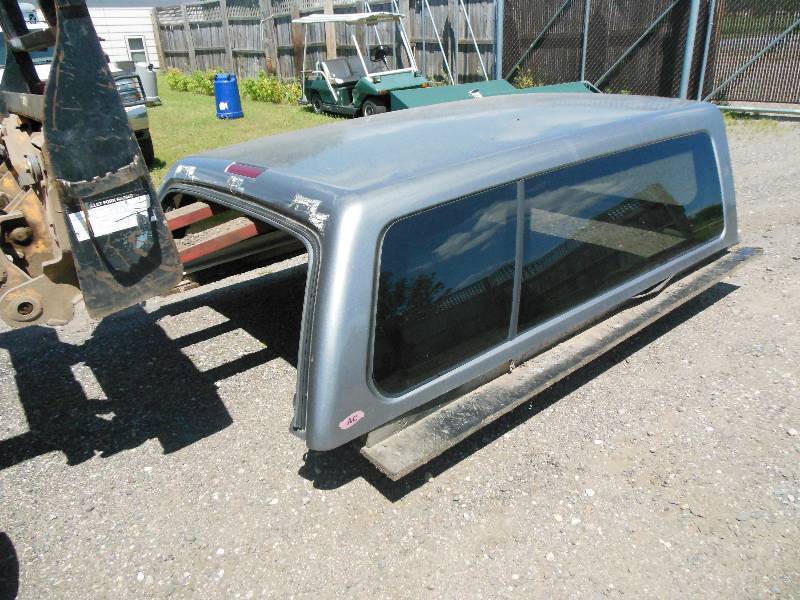 lot 93 image: Grey  Silver Fiberglass Truck Topper by Automotive Concepts - 82 L x 68 Wide (approx.) - No Rear Glass