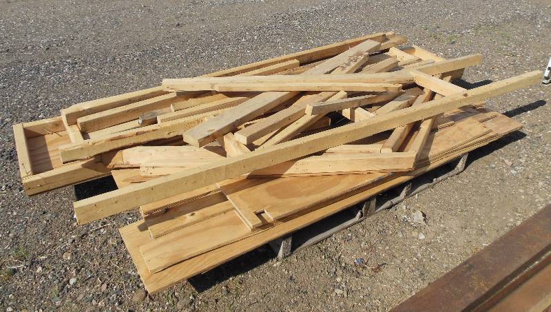 lot 96 image: Lumber - disassembled shelving from inside enclosed construction  trailer