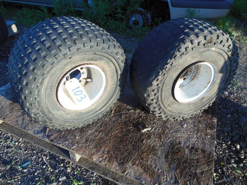 lot 103 image: Two OHTSU SP. Wamulass Tires and Rims 22 x 11.0 - 8 Tires - NOTE 1 tire is ripped open