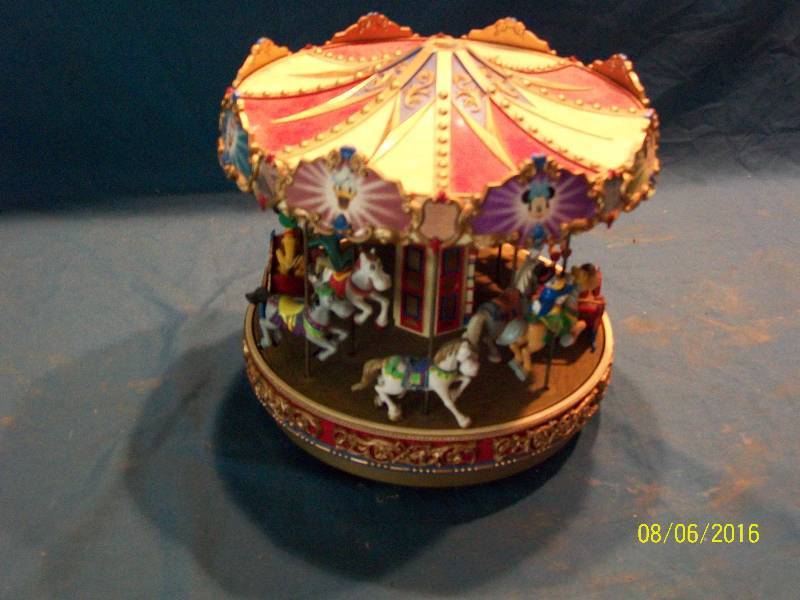 lot 6 image: Vintage Collectible Mr Christmas Animated & Illuminated Music CarouselPlays Christmas & Yr Rd Songs