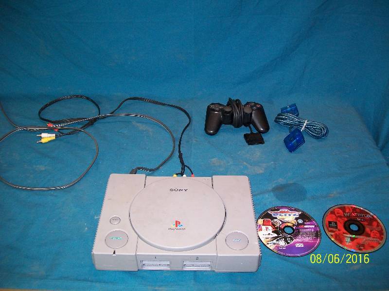 lot 8 image: Original Vintage Sony Playstation. Comes with Power Cord & AV Cord, Controller