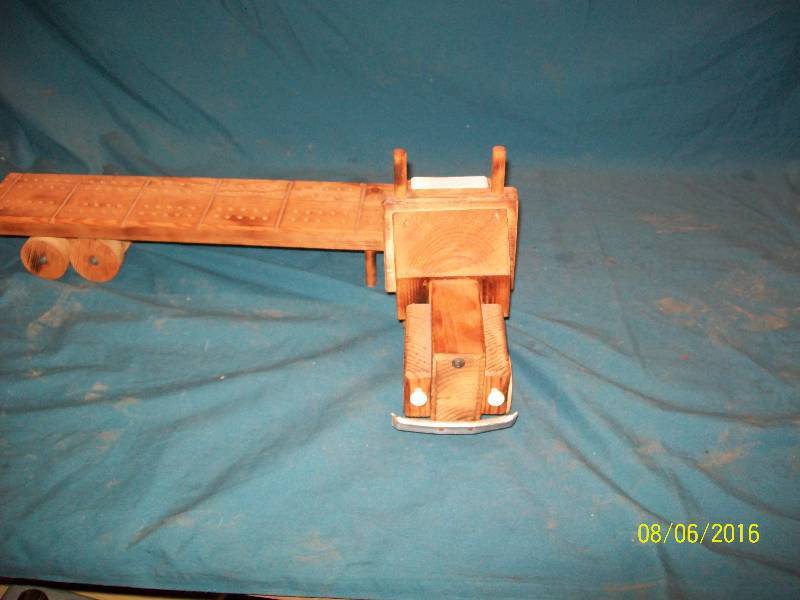 lot 22 image: Wooden Crafted Semi Truck Pulling Cribbage Board Trailer. 60 Hole Cribbage Board.