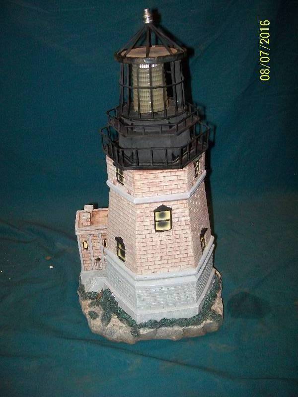 lot 50 image: Garden Lighthouse that resembles Split Rock Lighthouse. Top removes to replace battery