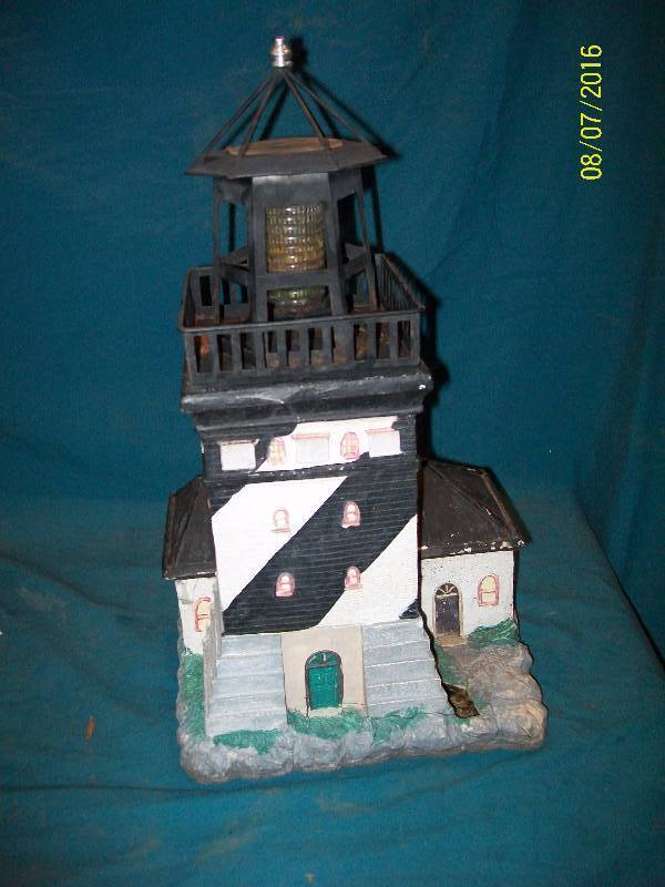 lot 51 image: Solar Garden Lighthouse. Has solar indicative top to light up when dark