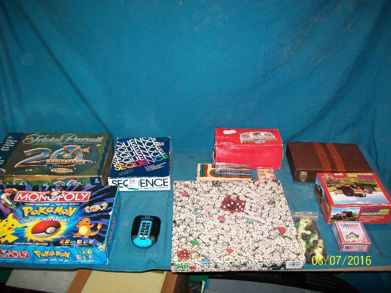 lot 42 image: Various Vintage Board Games. Monopoly POKEMON, Trivial Pursuit 20th Anniversary, ETC. See Pictures