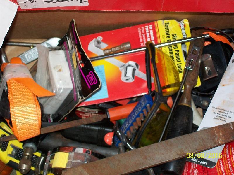 lot 57 image: Misc Tools Oil Funnel, Files, Oil filter wrenches, Pliers, Screwdrivers, Tie Down Ratchet Straps. See Pics.