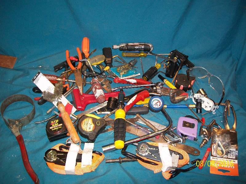 lot 58 image: Misc Tools File, Oil filter wrench, Tape measure, Pliers, Screwdrivers, Tie Down Ratchet Straps. See Pics