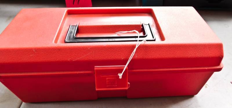 lot 46 image: red toolbox with stapler and many sizes of staples